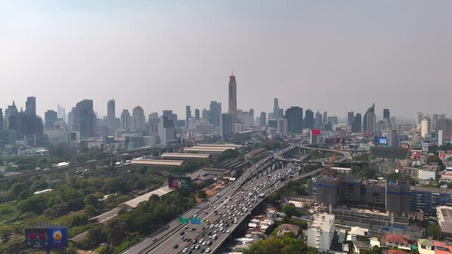 Bangkok cityscape and Sirat Expressway. High building Baiyoke tower in the distance