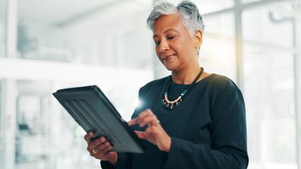 Business, research and tablet with mature woman in office for information, project management,...