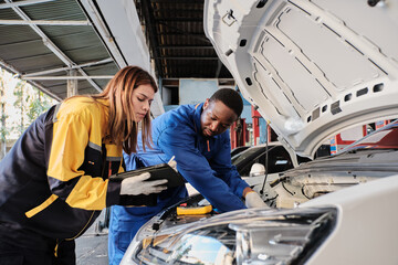 EV car check, mechanic workers coworker inspects and maintains service of electric engine and...