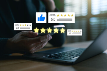 Customer review and feedback rating concept. Hand using smartphone with star rating and satisfaction icon on virtual screen. Online reputation management idea.