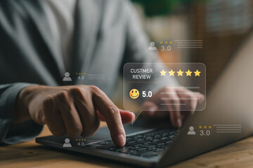 Close-up of hands typing on laptop with customer review ratings. Concept of online feedback, service evaluation, user experience, digital rating, and customer satisfaction analysis.