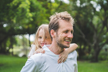 Fototapeta premium Happy family parent children having picnic outdoor activity. Enjoy happiness moment summer playing together including father mother son and daughter relaxing in the morning sunrise.