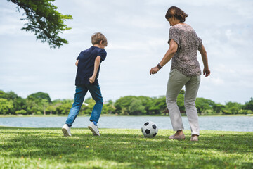 Happy family parent children having picnic outdoor activity. Enjoy happiness moment summer playing together including father mother son and daughter relaxing in the morning sunrise.