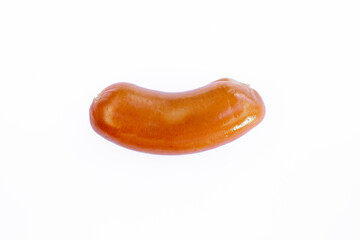 Close-up of a delicious sausage on a clean white background. Object isolated with copy space