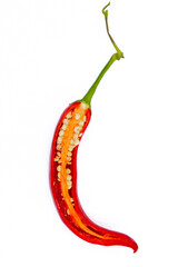 Cut hot chili pepper showing spicy core and seeds, bright red color on clean white background, top view
