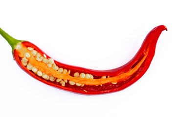 Close up of half of red chili pepper isolated on white background, seeds and juicy inner texture...