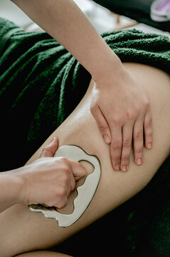 Young woman massagist making anti-cellulite massage
