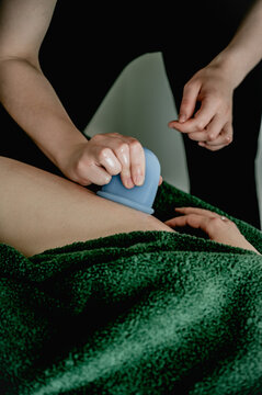 Young woman massagist making anti-cellulite massage