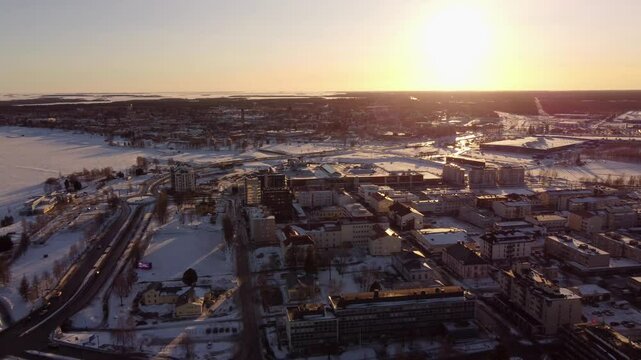 Cityscape Of Tornio At Sunset During Winter In Finland - Drone Pullback
