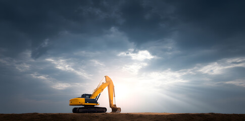 Fototapeta premium Yellow excavator digging soil in construction site 