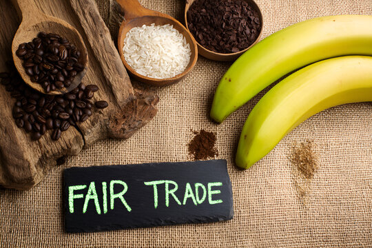 A Fair Trade Still Life Featuring Coffee, Rice, Cacao Nibs, Bananas, and a Rustic Setting