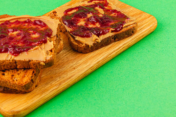 PB&J on toast with a green background