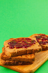 Peanut butter and jelly sandwich on brown bread