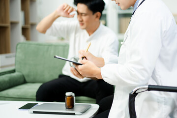 Fototapeta premium Doctor consulting with a stressed male patient in private clinic. Mental health care, therapy, empathy, and emotional support