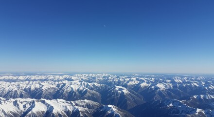 Aerial Photo of Snow Covered Mountain Range Under Blue Sky