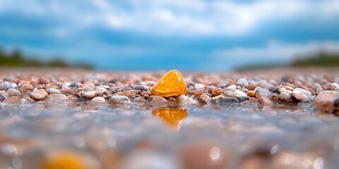 Yellow Stone on Beach Reflected in Water