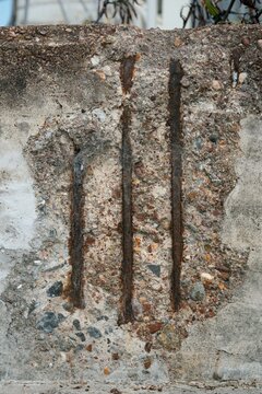 Broken concrete revealing reinforcement steel &ndash; urban decay detail