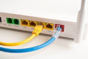 Ethernet cable with wireless router connect to internet service provider internet network.