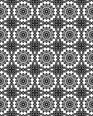 Detailed floral shapes create a striking black and white pattern with symmetrical designs throughout the layout