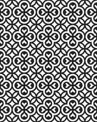 Black and white circles create a repetitive geometric pattern, showcasing varied shapes on a uniform background with no visible borders