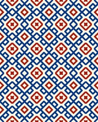 Vibrant geometric pattern showcases interconnected red and blue diamonds on a crisp white background, perfect for fabric or wallpaper design
