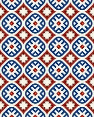 Intricate geometric shapes arranged in a colorful pattern with alternating red, blue, and white on a grid layout