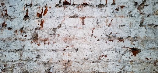 The texture of the brick wall of an old crumbling building.