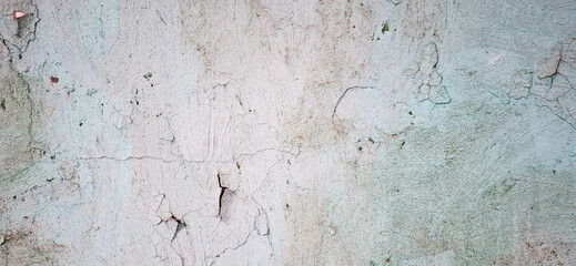 The texture of an aged wall with peeling paint.