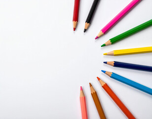 A set of colored pencils arranged in a circular pattern on a blank white surface.