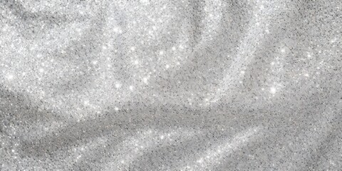 A silver and black sequined fabric with a glittery texture, draped and draped, with a white background and a few scattered sparkles.