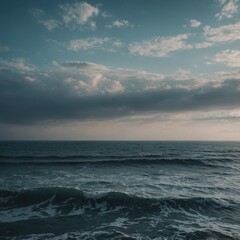 Obraz premium A stormy sky with dark clouds looms over the vast ocean where waves crash along the horizon at sunset