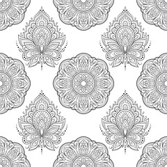 Seamless decorative ornament in ethnic oriental style. Lotus flower and mandala for Henna, Mehndi, tattoo, decoration. Doodle outline hand draw vector illustration.