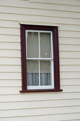 Old wooden window of classic New Zealand weatherboard house