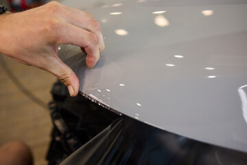 Applying a Protective Film on the Surface of Your Car for Enhanced Durability and Shine