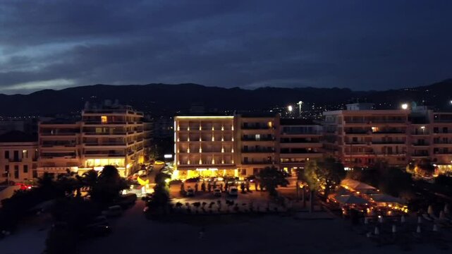 Aerial right dolly footage of Kalamata city on dusk on a cloudy afternoon 4K