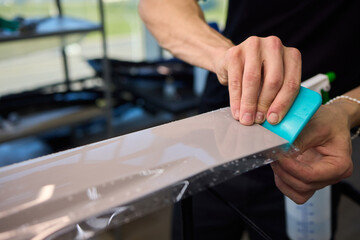 Applying a Protective Film on the Surface of Your Car for Enhanced Durability and Shine