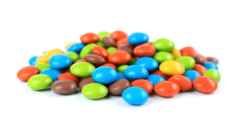 Pile of colorful chocolate coated candy isolated on white background