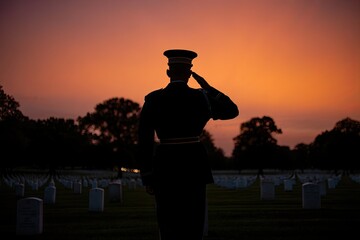 Silhouette of a soldier saluting in a cemetery at sunset with respect and honor