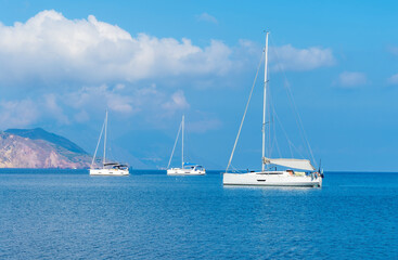 Fototapeta premium sailing yacht boats with white sails in blue sea . Luxury yachts Regata.Sailing in the wind through the waves at the Sea