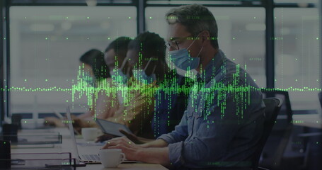 Statistical data processing against caucasian man wearing a face mask working at office