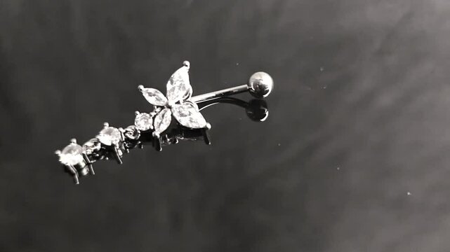 Belly button earrings with stones and a pendant in the shape of cannabis leaves. summer decoration. Piercing