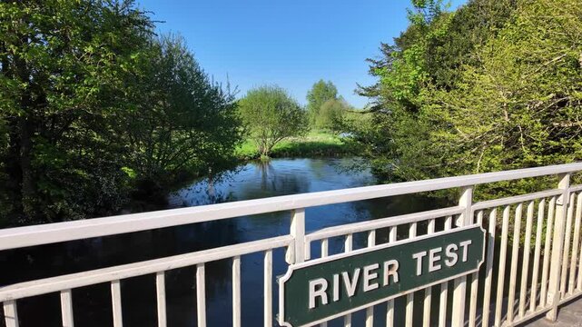 Stockbridge Hampshire England UK. 09.05.2025. Video.  Sign for the River Test a famous chalk stream in Stockbridge Hampshire England UK.