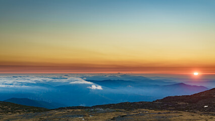 Obraz premium Burning sunset above clouds, Serra da Estrela, Portugal.