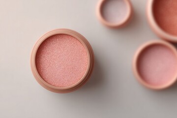 collection of modern makeup products arranged on sleek white surface