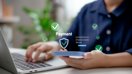 The user makes a secure online payment using a smartphone and a laptop with a fintech interface.