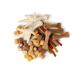 Assorted dog kibble, many canine food, different color dry pet food mix, various dog snack pile