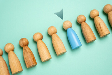 Select a person from a sample group. Suitable candidate. Hiring. Recruiting for service. Promotion at work. Career development. Finding the most suitable individual for the role or service.