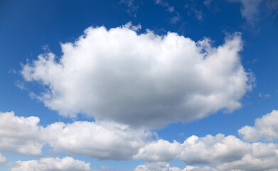 A beautiful blue sky with soft, white clouds, for an abstract background