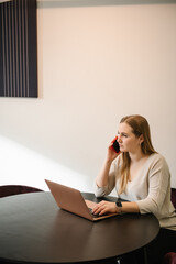 Woman talking on the phone and disappointed with the market drop. Financial stock analysis, doing trading market research, buying or selling cryptocurrency, reviewing risks or profits. Sell or buy.