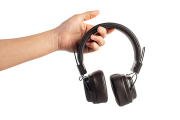 HeadPhones in hand, Headphones isolate on transparent. Wireless headphones in brown.